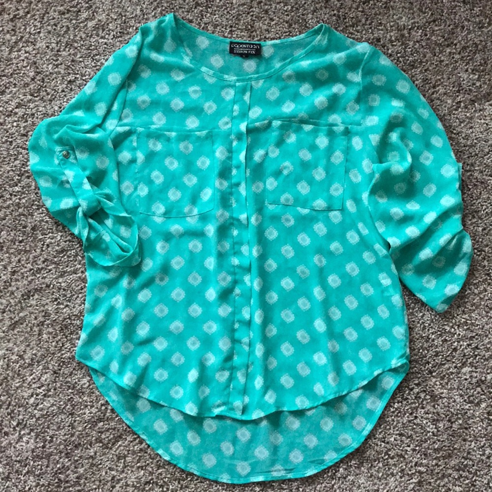 Turquoise blouse.